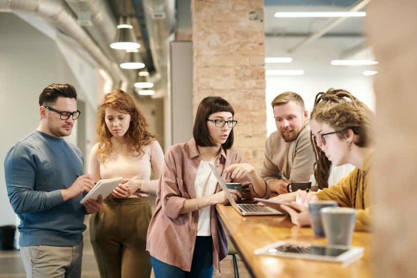 people in an office discussing something