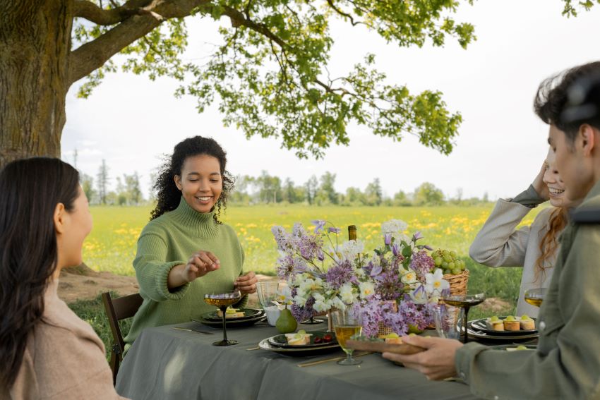 group of people enjoying a meal outdoors