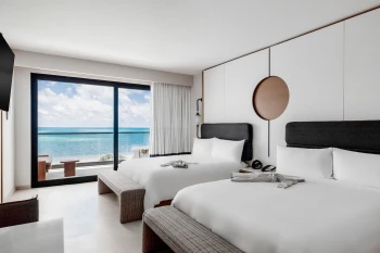 suite with two beds at ava resort cancun