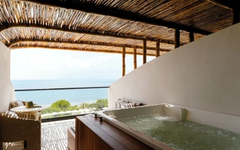 view from oceanfront suite with hot tub at AVA Resort Cancun