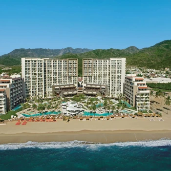 aerial view of the buildings and pools and beach of dreams and secrets vallarta bay in Mexico