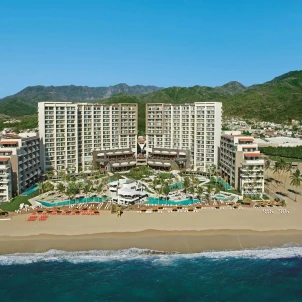 aerial view of the buildings and pools and beach of dreams and secrets vallarta bay in Mexico