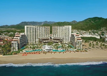 aerial view of the buildings and pools and beach of dreams and secrets vallarta bay in Mexico