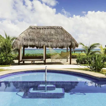 pool and poolside hammock and cabana at El Dorado Royale