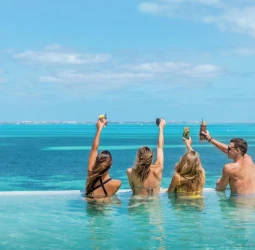 people in the rooftop pool at Garza Blanca Cancun