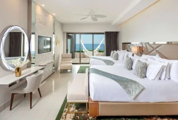 suite with two beds at Garza Blanca Resort & Spa Los Cabos