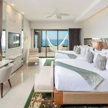 suite with two beds at Garza Blanca Resort & Spa Los Cabos