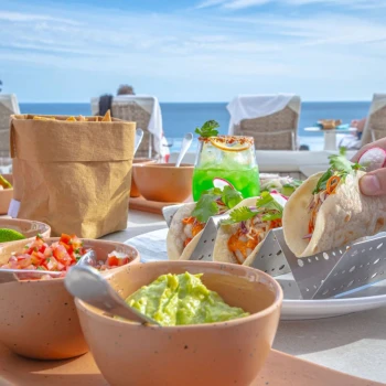 tacos and nachos served at a restaurant at Garza Blanca Resort & Spa Los Cabos