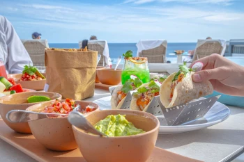 tacos and nachos served at a restaurant at Garza Blanca Resort & Spa Los Cabos