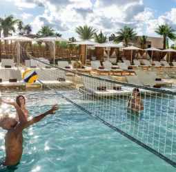 people playing pool volleyball at Hyatt Vivid Grand Island