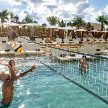 people playing pool volleyball at Hyatt Vivid Grand Island