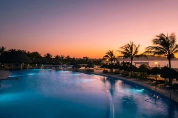 sunset over the pools at Iberostar Selection Playa Mita