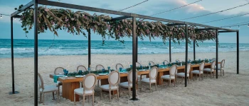 team dinner setup on the beach at Iberostar Selection Playa Mita