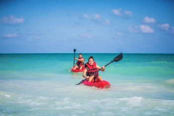 couple kayaking in the sea near Majestic Mirage Costa Mujeres