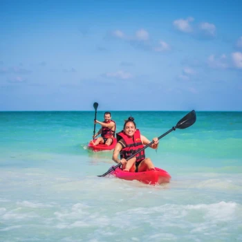 couple kayaking in the sea near Majestic Mirage Costa Mujeres