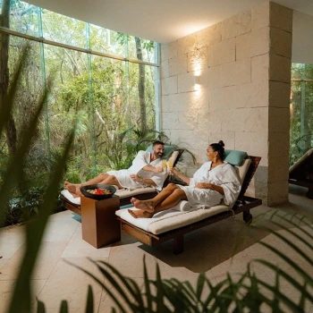 man and woman at the spa at the beachfront by fives resort