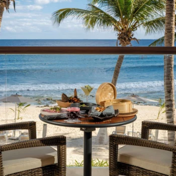 delicious room service breakfast kept on oceanfront balcony table at The Beachfront by The Fives