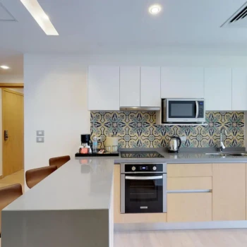 kitchenette inside a suite at The Fives Beach Hotel and Residences