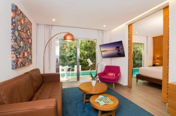 living room of one bedroom suite at The Fives Beach Hotel and Residences